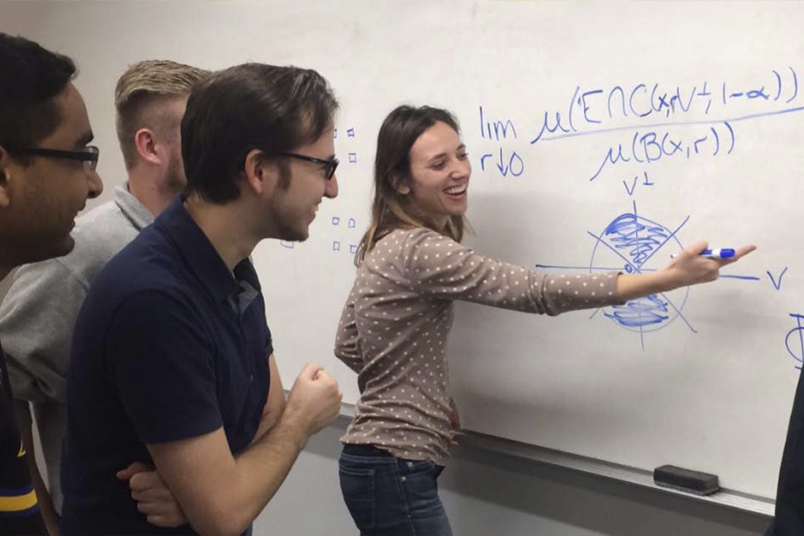 Students at a whiteboard.